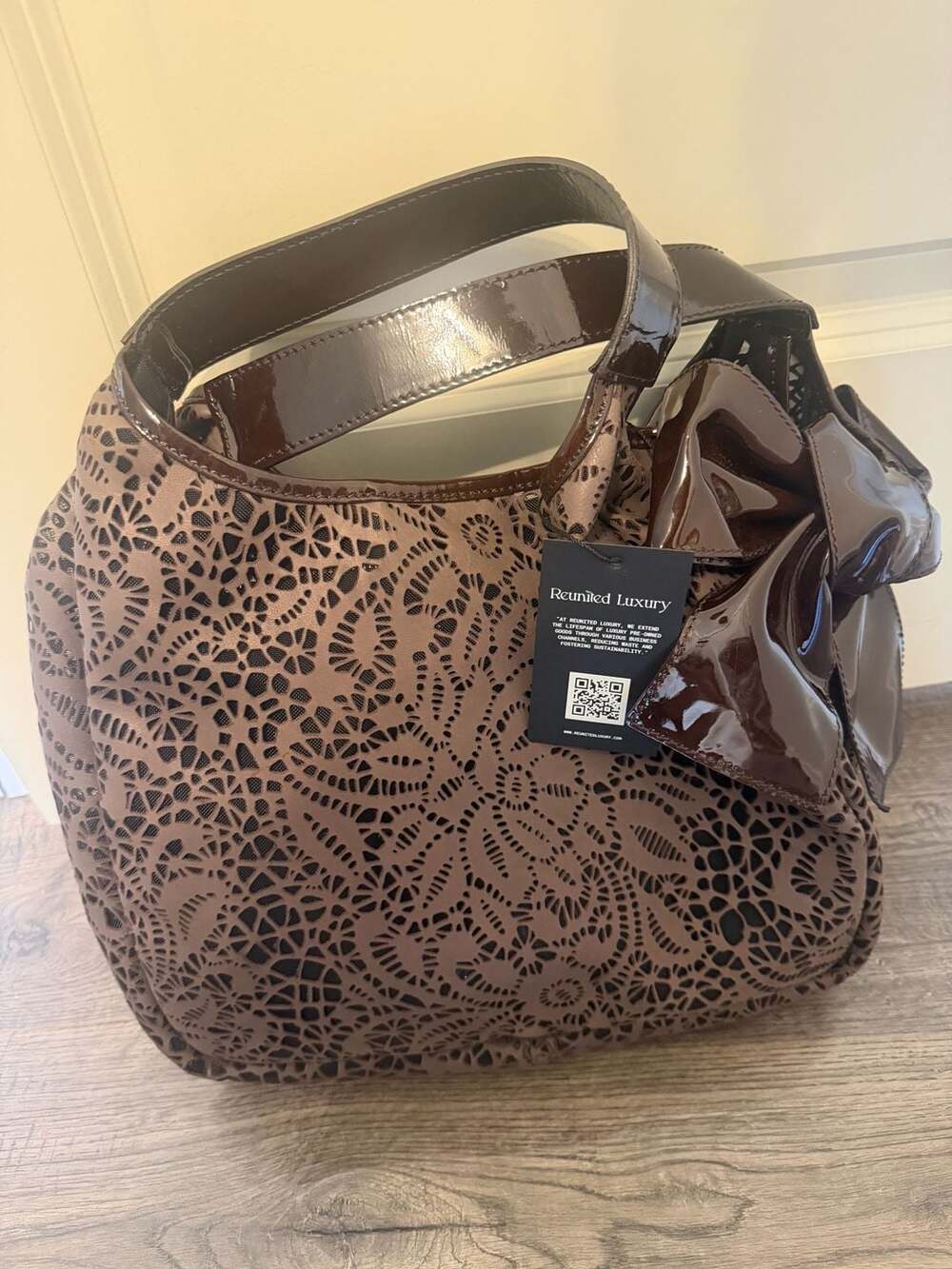 Valentino Garavani Laser-Cut Floral Pattern Brown Leather Handbag with Bow Detai